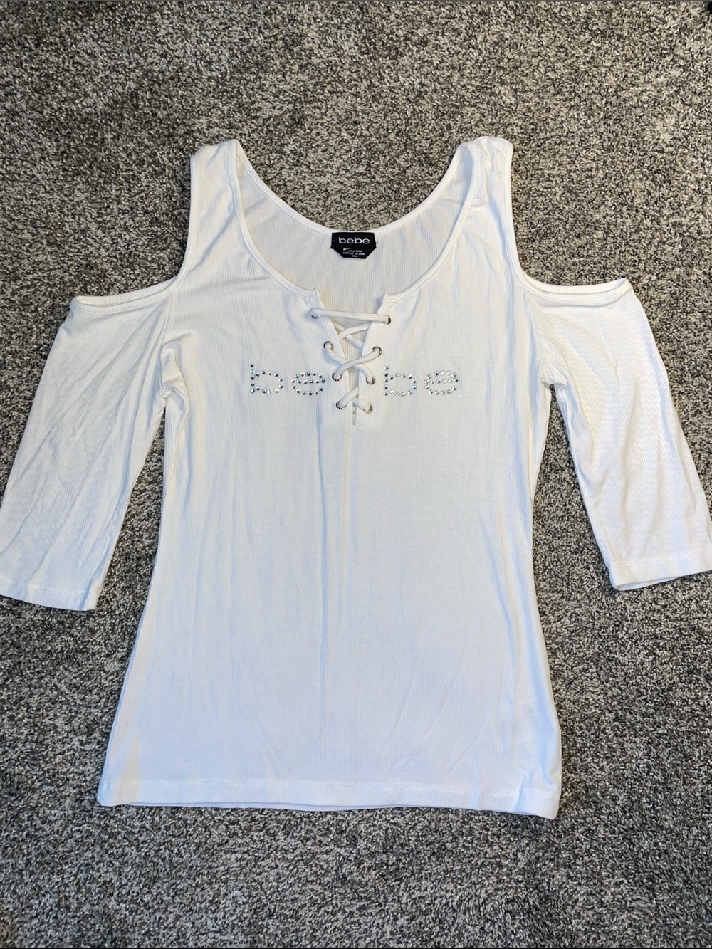 NWOT bebe White Cold-Shoulder Lace-Up Logo Top.  Size Medium.